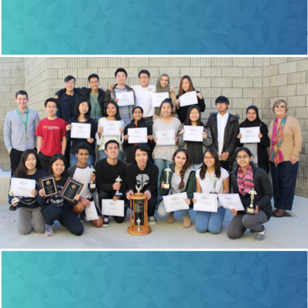 Irvine High School Publication team posing with trophy